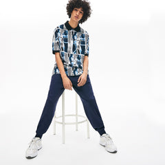 Mens Unisex LIVE Loose Fit Graphic Print Cotton Polo Shirt | Lacoste White / Blue / White • M3L