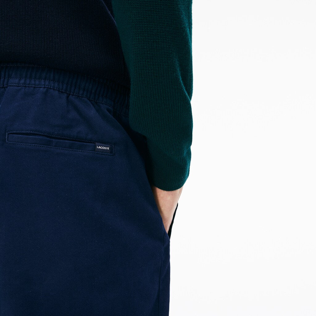 Mens   Slim Fit Elasticized Cotton Twill Chino Pants | Lacoste Navy Blue • 166