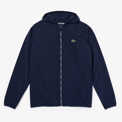 Mens   SPORT Water-Resistant Foldable Ultra-Light Zip Golf Jacket | Lacoste Navy Blue / Red • Xvf