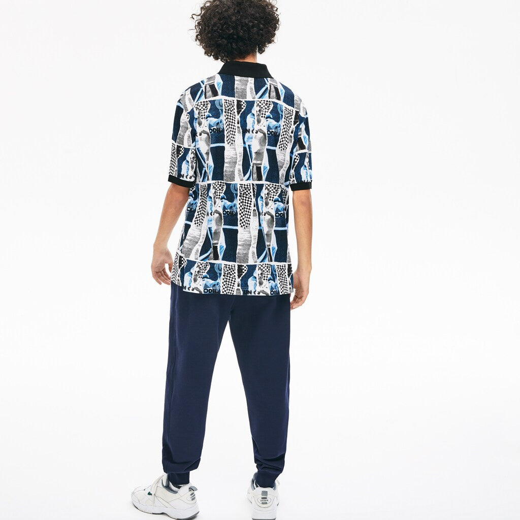 Mens Unisex LIVE Loose Fit Graphic Print Cotton Polo Shirt | Lacoste White / Blue / White • M3L