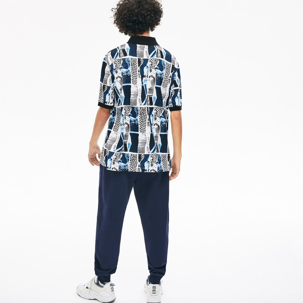 Mens Unisex LIVE Loose Fit Graphic Print Cotton Polo Shirt | Lacoste White / Blue / White • M3L